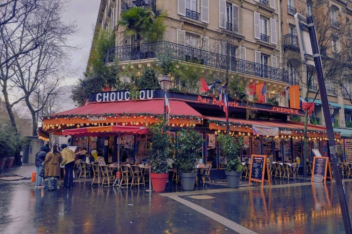 Paris winter street December evening rain reflections