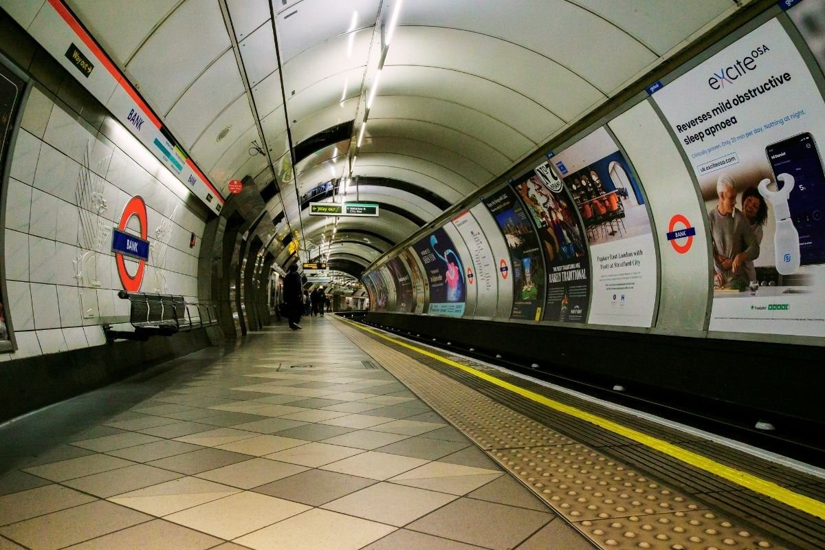 London public transport costs 2026: long interchange corridor where extra changes create fatigue and trigger repair spending