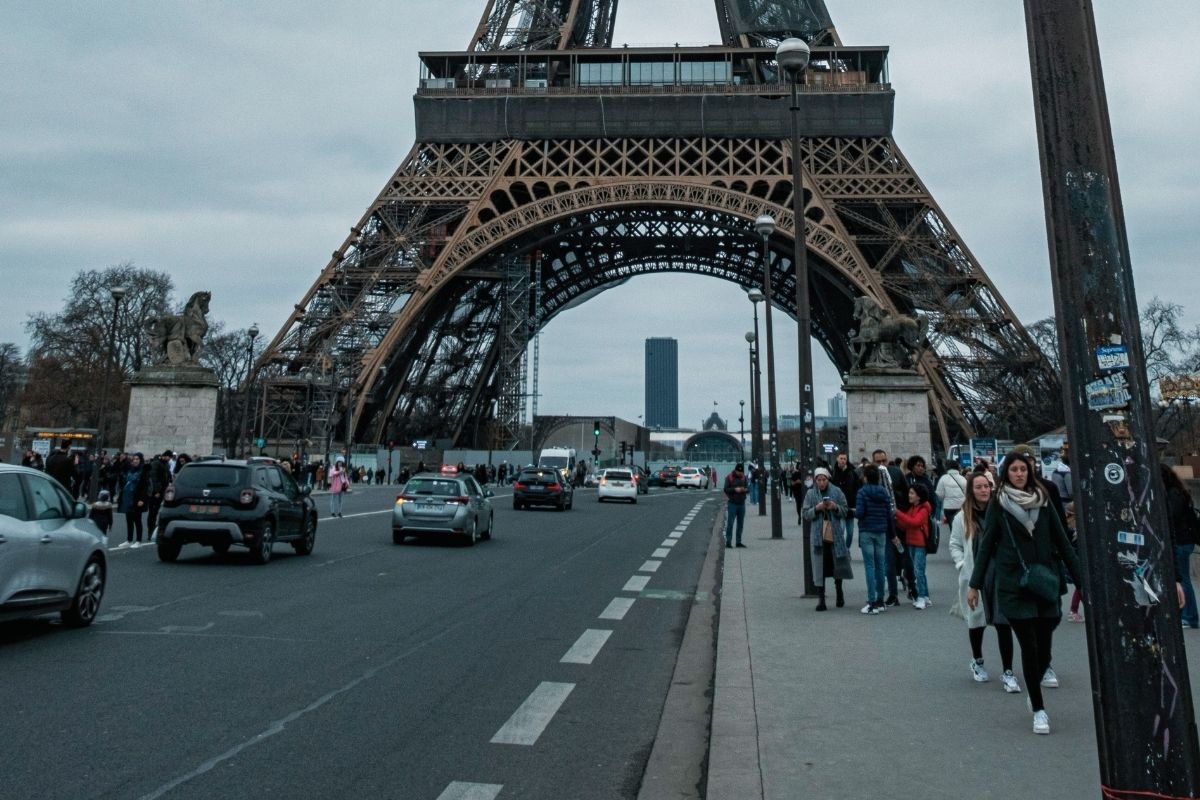 Paris events in 2026 at dusk near the Eiffel Tower with winter clouds and short daylight, showing the reality of timed entries and fixed start times