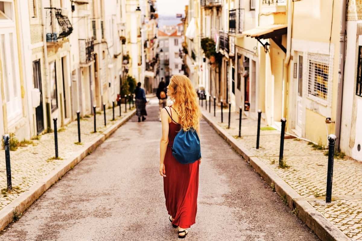 Solo traveler walking through Montmartre streets