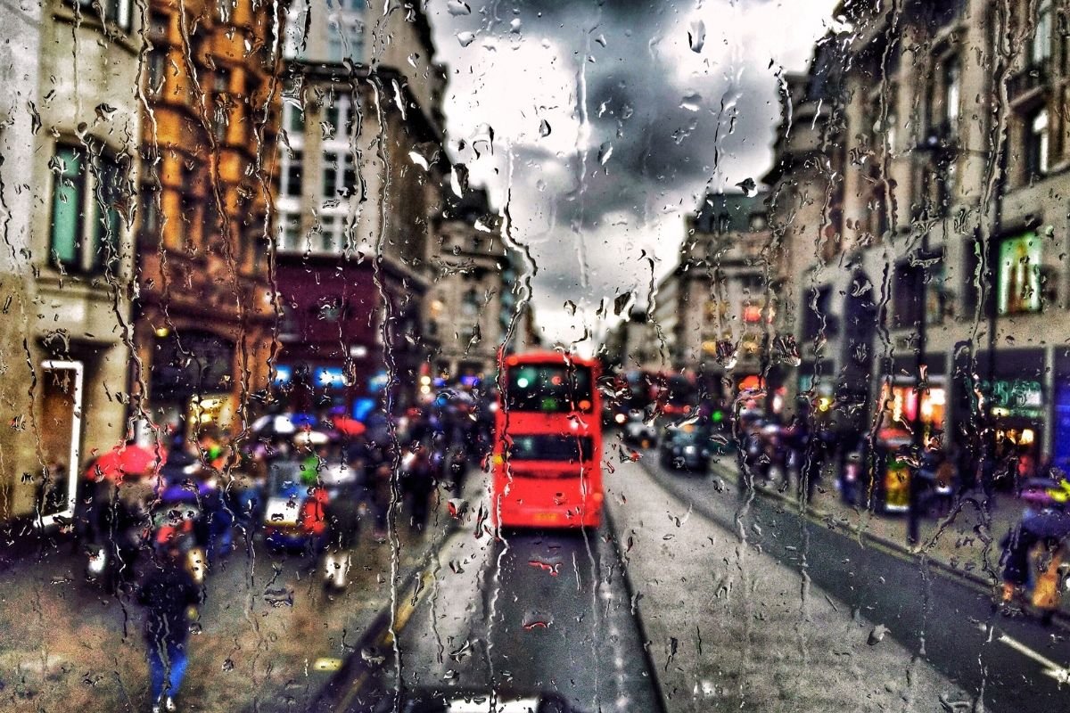 London Budget Guide 2026: a rainy London street decision moment that triggers repair spending like extra rides and rushed meals