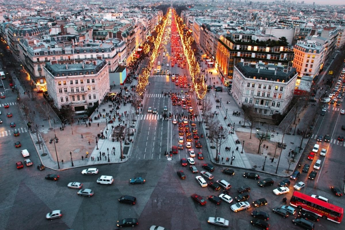 crowded Paris street near major attractions, illustrating how transitions and crowds create friction for first-timers