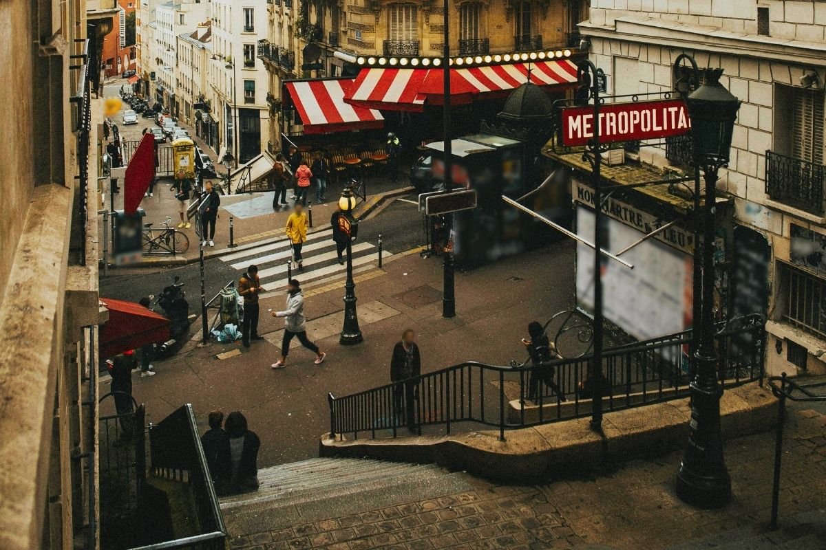 Is Paris good for first-time travelers: calm Paris street near a Metro station, showing how a good base makes evenings and returns easier