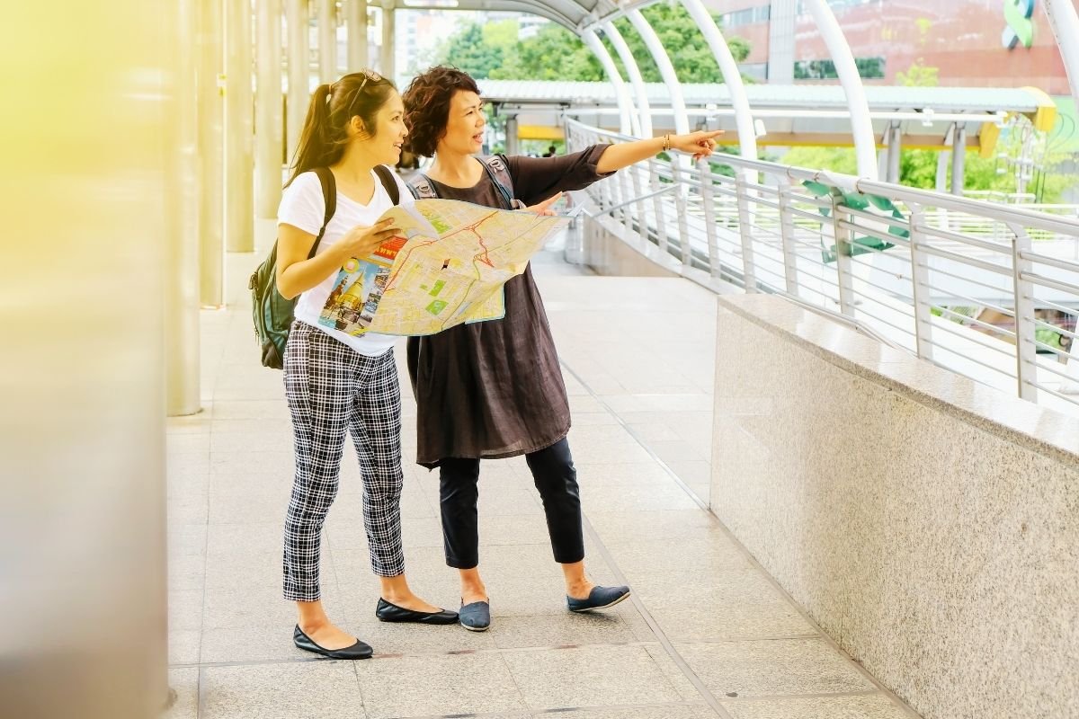 tourists checking directions near a Metro exit, showing how short stays collapse under transitions and timing pressure