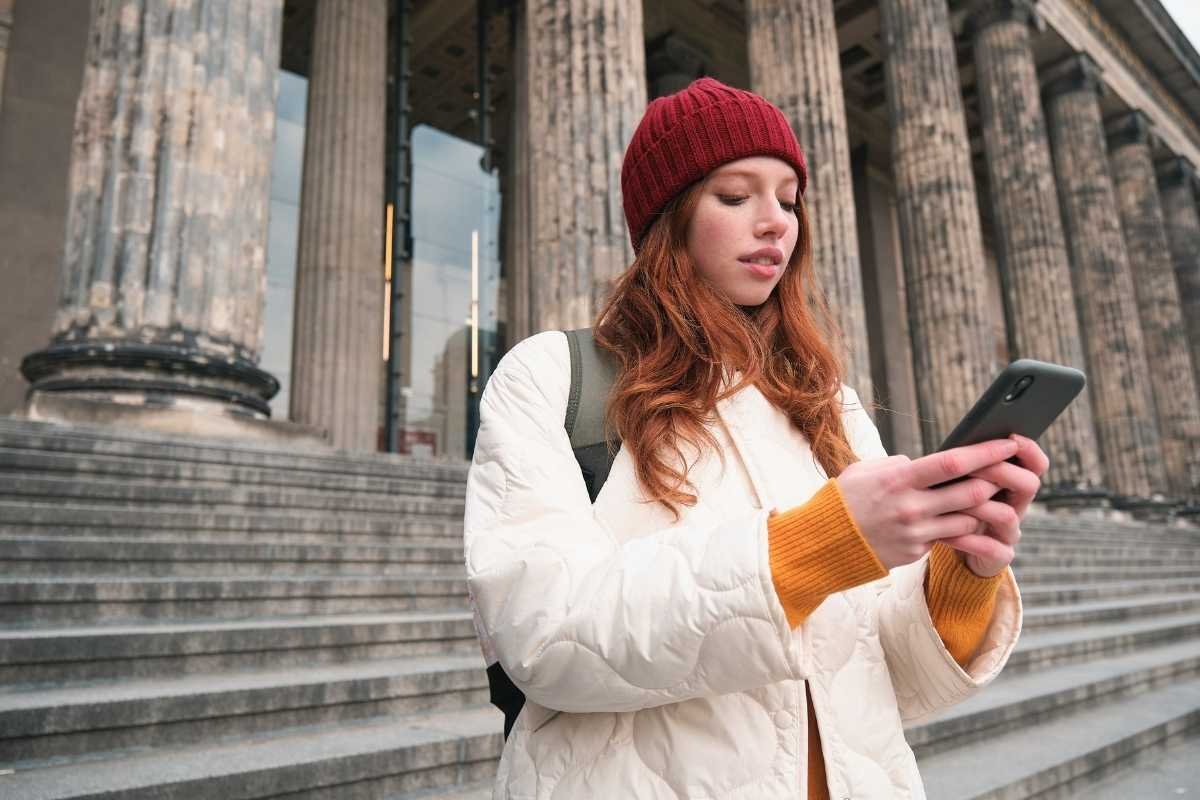 Paris events in 2026 planning system: traveler reviewing a simple timed schedule near a Paris landmark, showing buffers and anchor blocks