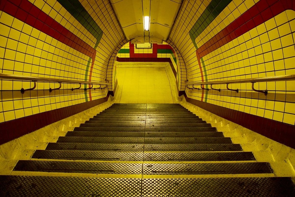 London Underground station corridor with stairs—why station layout matters for strollers and tired families.