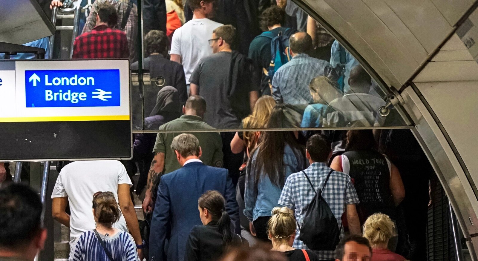 London Safety Guide 2026: busy station exit where tourists pause and expose phones, creating predictable moments for snatch theft