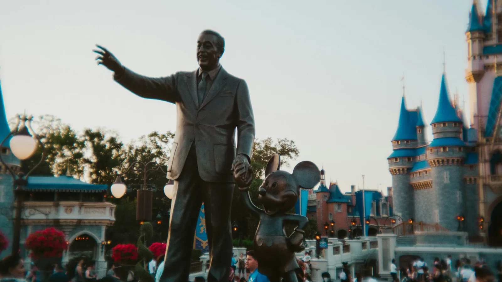 Disney emotional atmosphere at Magic Kingdom Orlando Walt Disney and Mickey statue in front of Cinderella Castle at Disney World Orlando