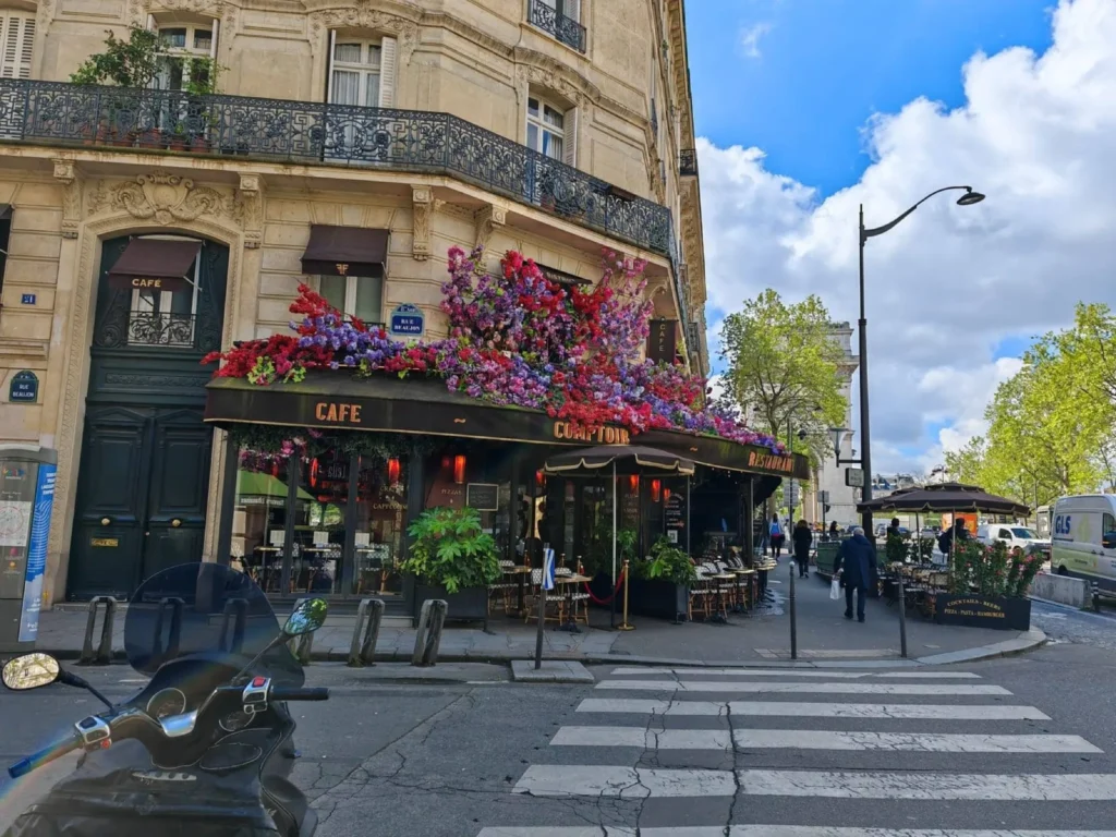 Flower-covered café on a street near the Latin Quarter in Paris