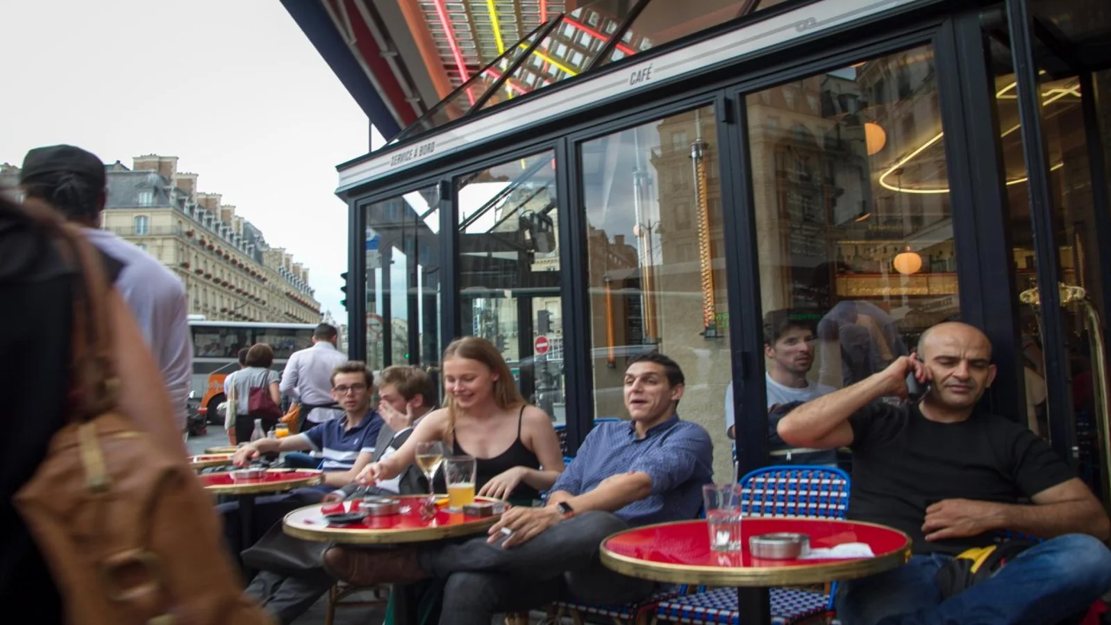 Travelers relaxing at a Paris café between museum visits