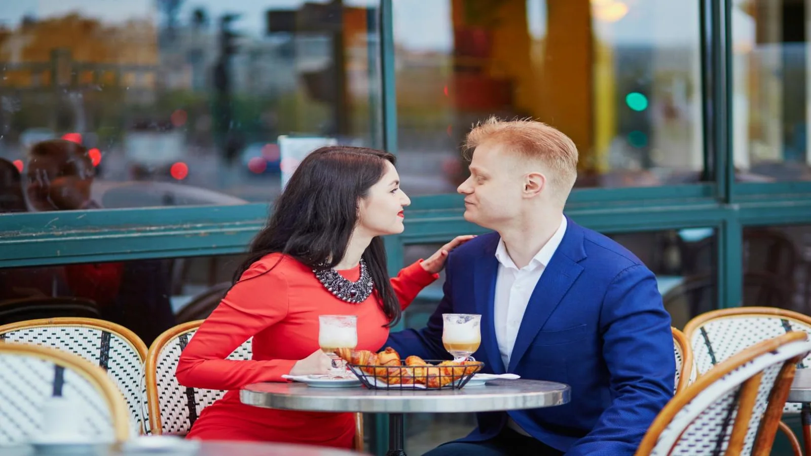 Couple enjoying dinner at a romantic French bistro terrace