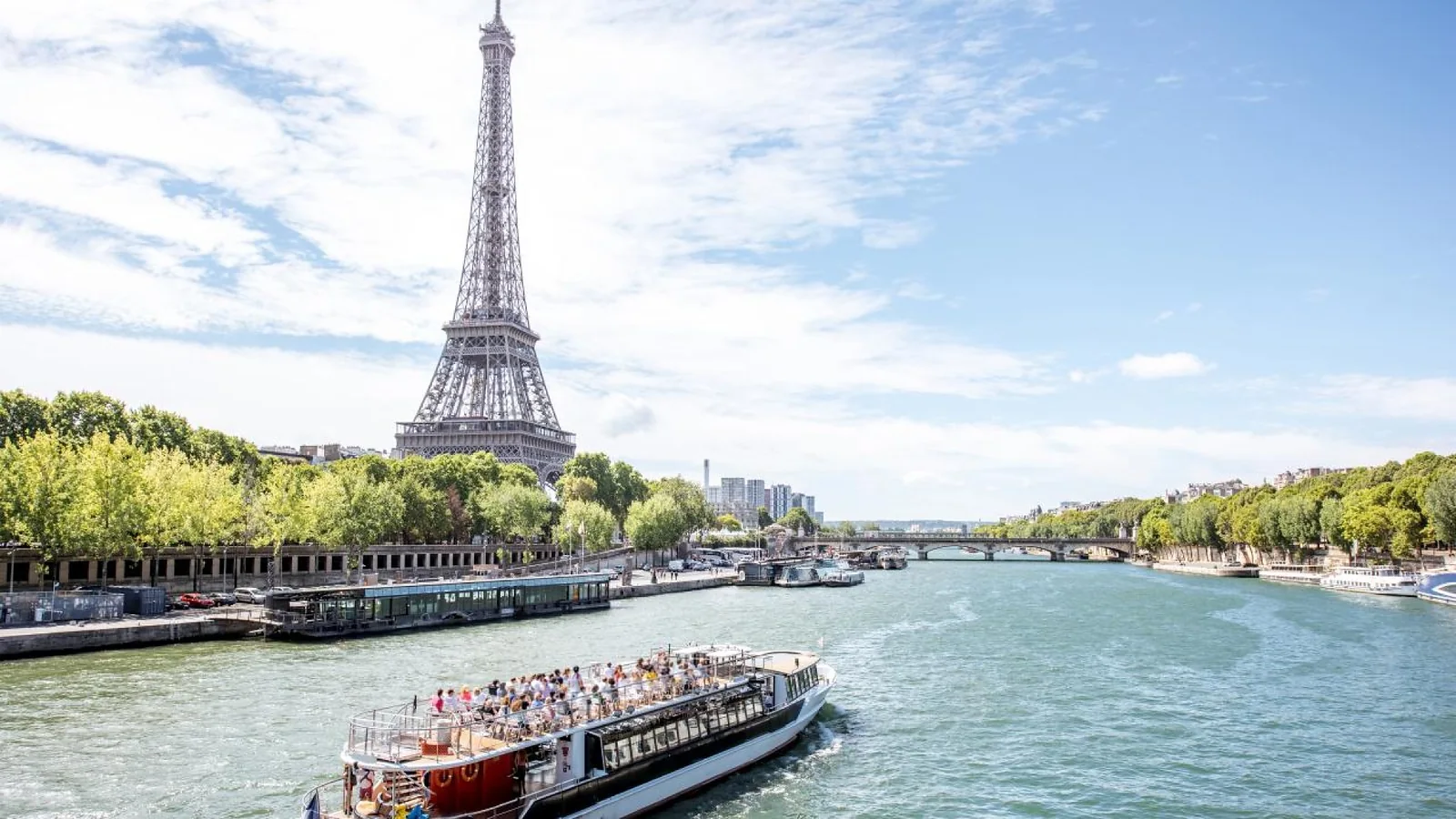 Tourist boat cruising on the Seine River with the Eiffel Tower