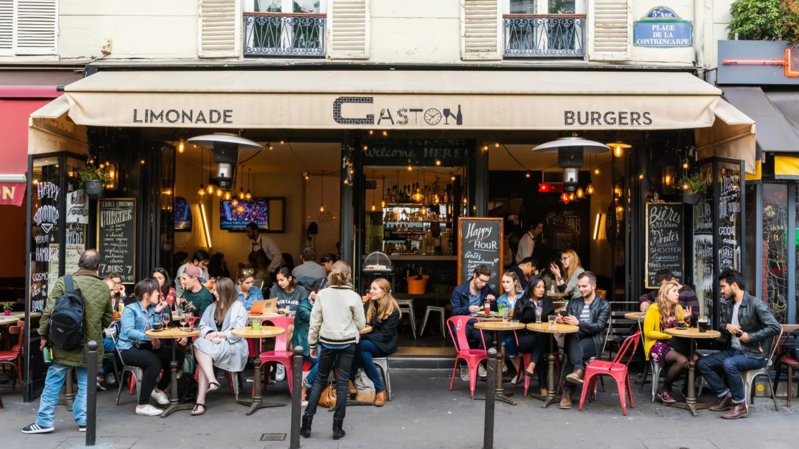 Busy Paris café terrace illustrating more affordable dining options in the city