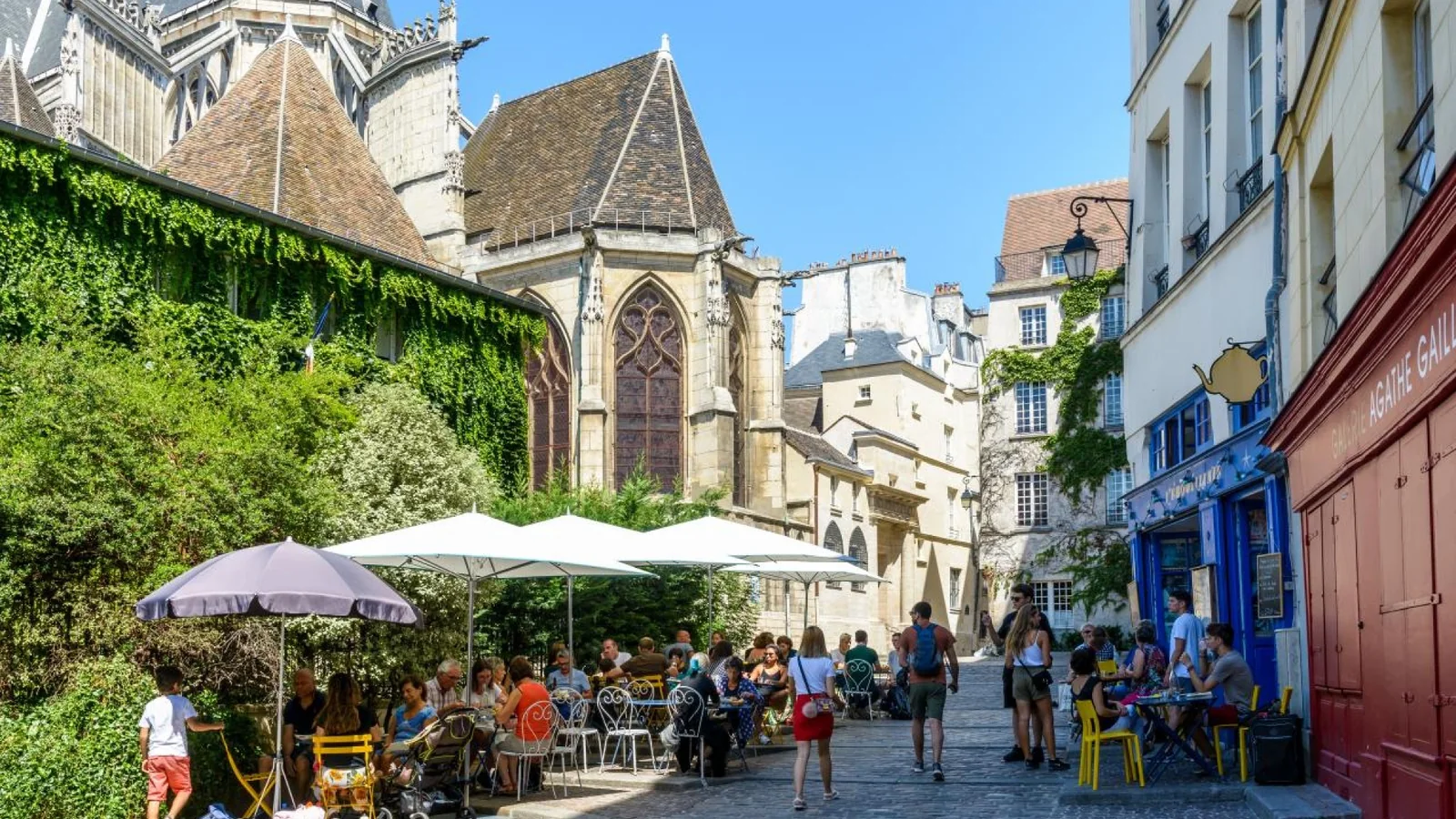 Outdoor café terrace in a historic square in Le Marais