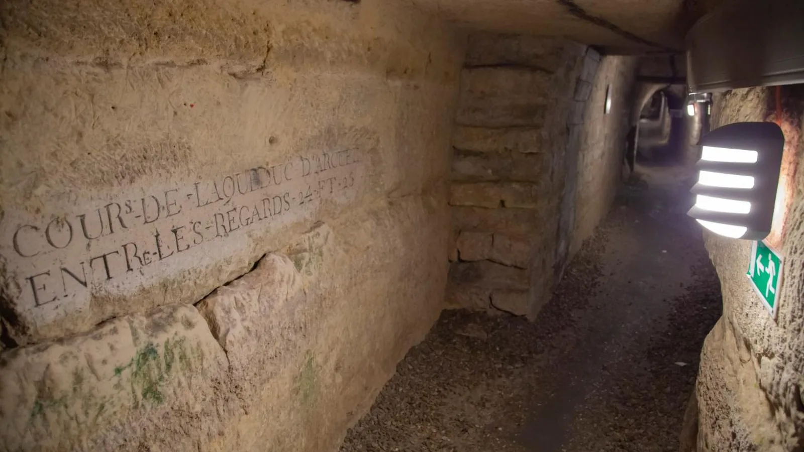 Narrow underground stone passage along the visitor route