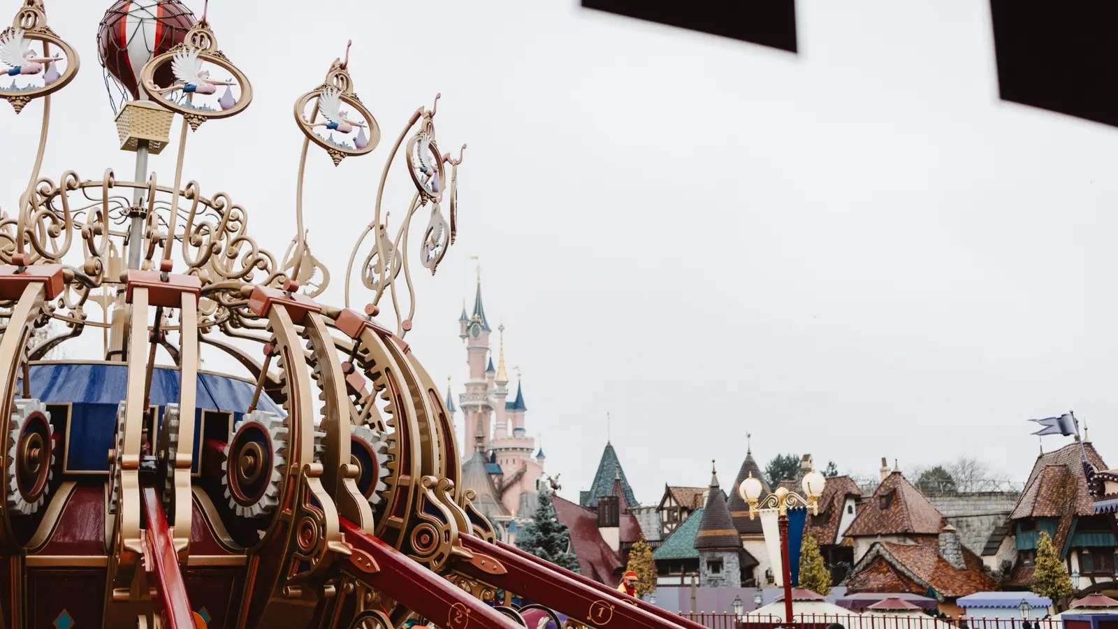 Fantasyland carousel with Sleeping Beauty Castle in the background