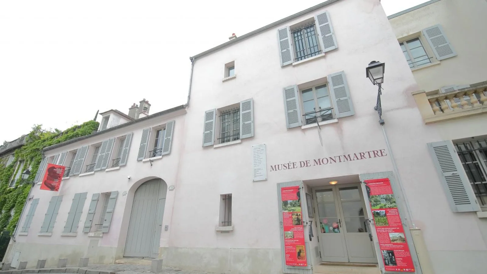 Exterior of Musée de Montmartre on Rue Cortot with entrance signs