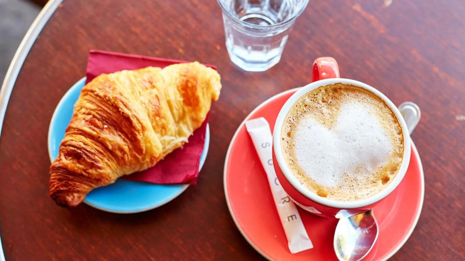 Croissant and café crème on a Paris café table