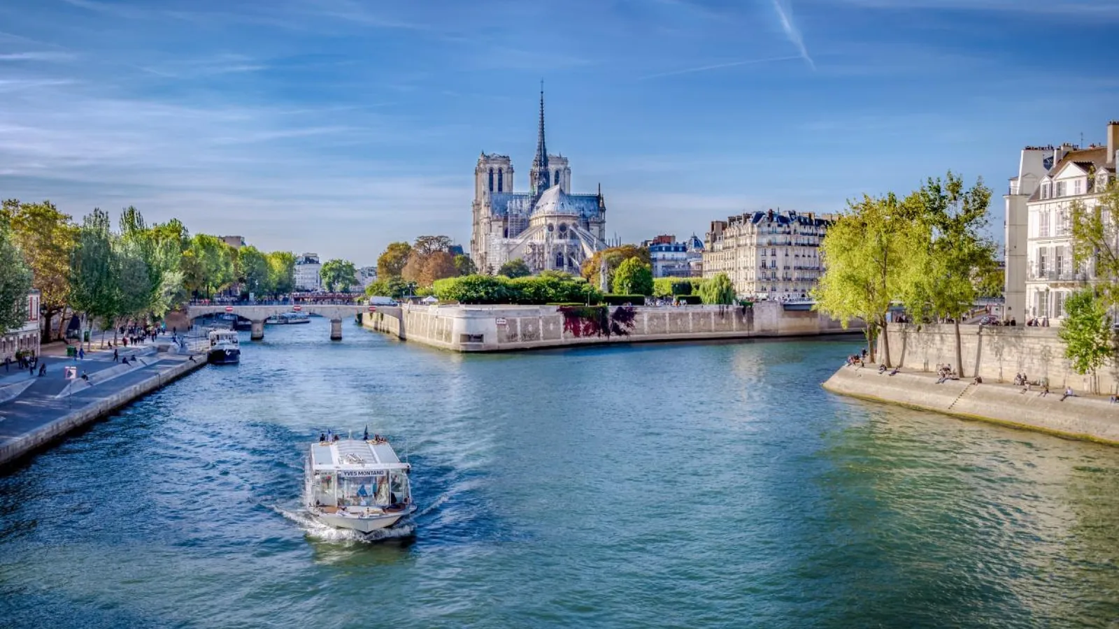 Seine River cruise approaching Notre-Dame Cathedral in Paris