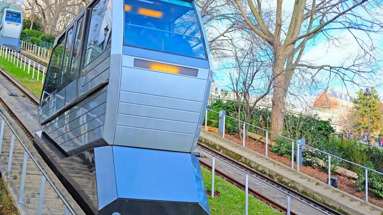 Funicular carriage climbing the steep hillside toward Sacré-Cœur