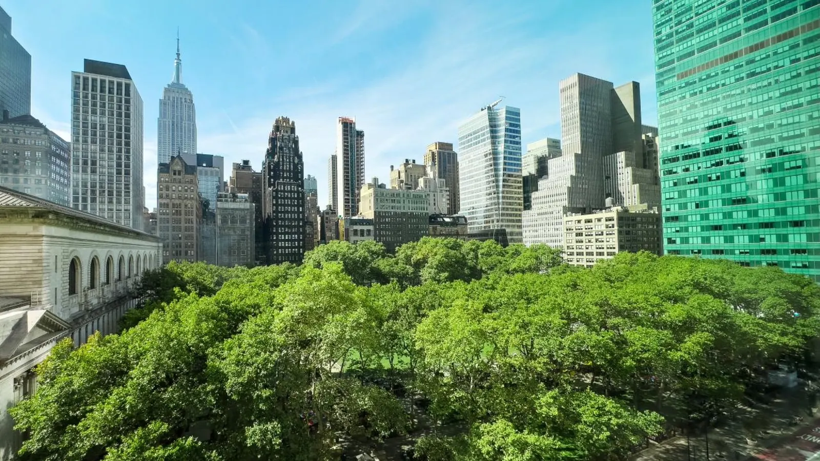 Aerial view of Bryant Park and Midtown Manhattan buildings, a central area to stay in NYC