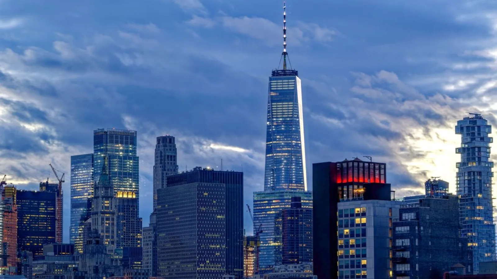 Lower Manhattan skyline and One World Trade Center at dusk